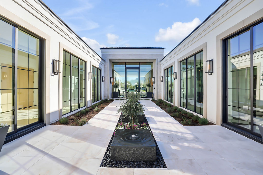 A courtyard entry to a custom home